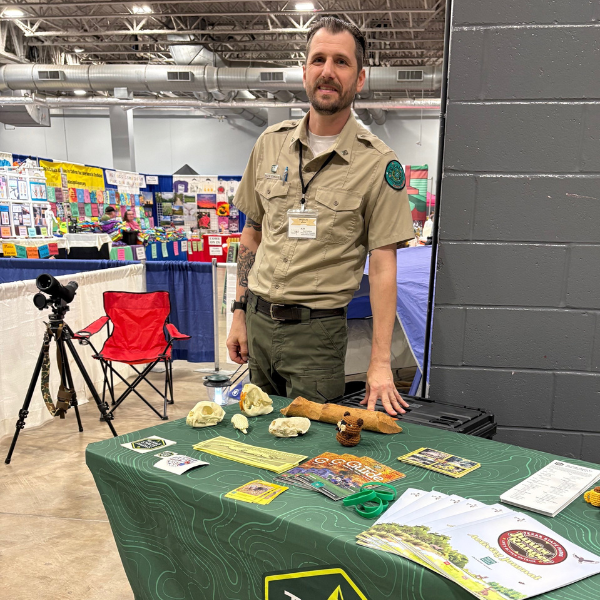 Volunteer at a Big Thicket outreach table during Champions for Nature