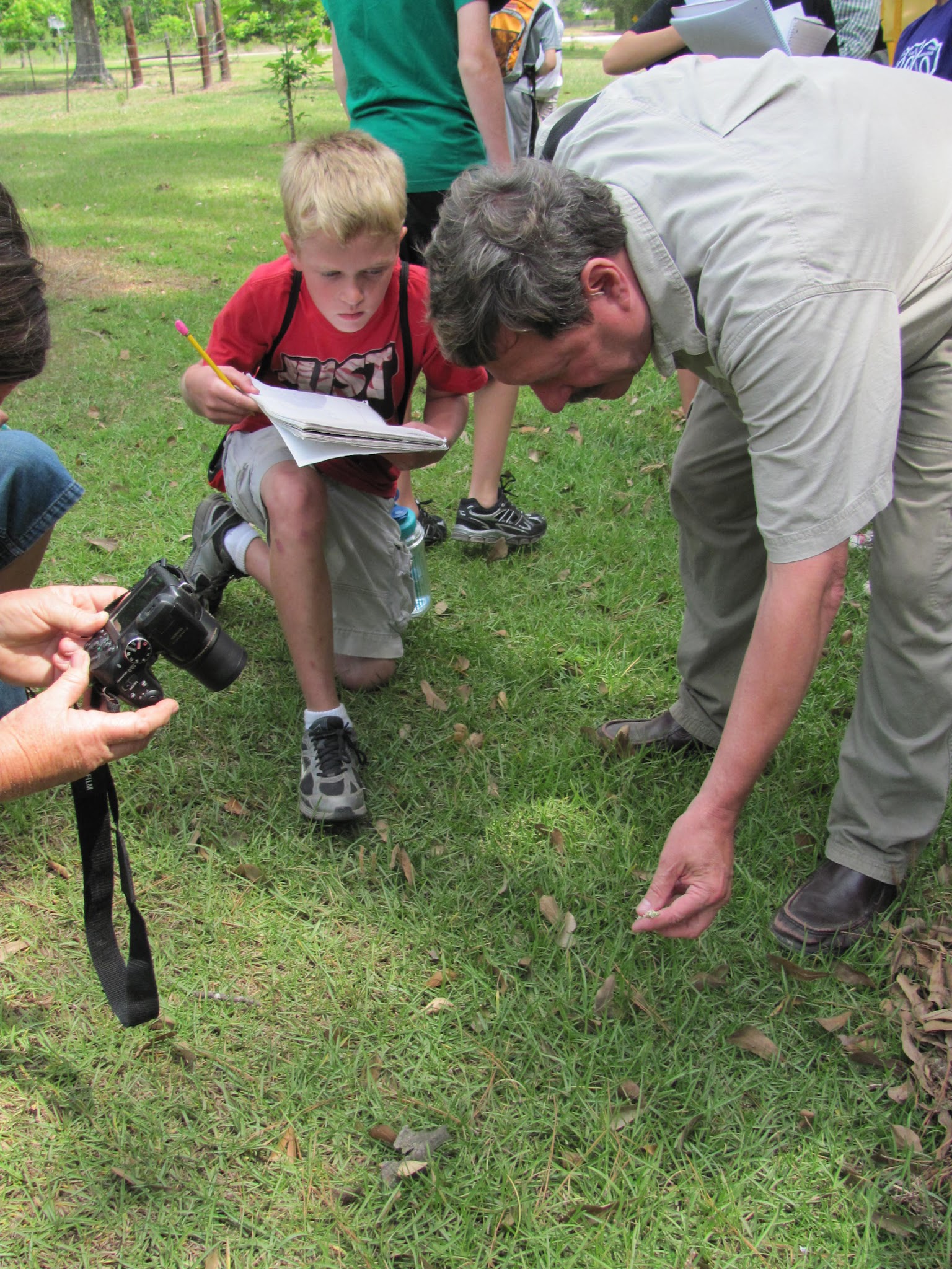 Guided hike participant recording an outdoor observation